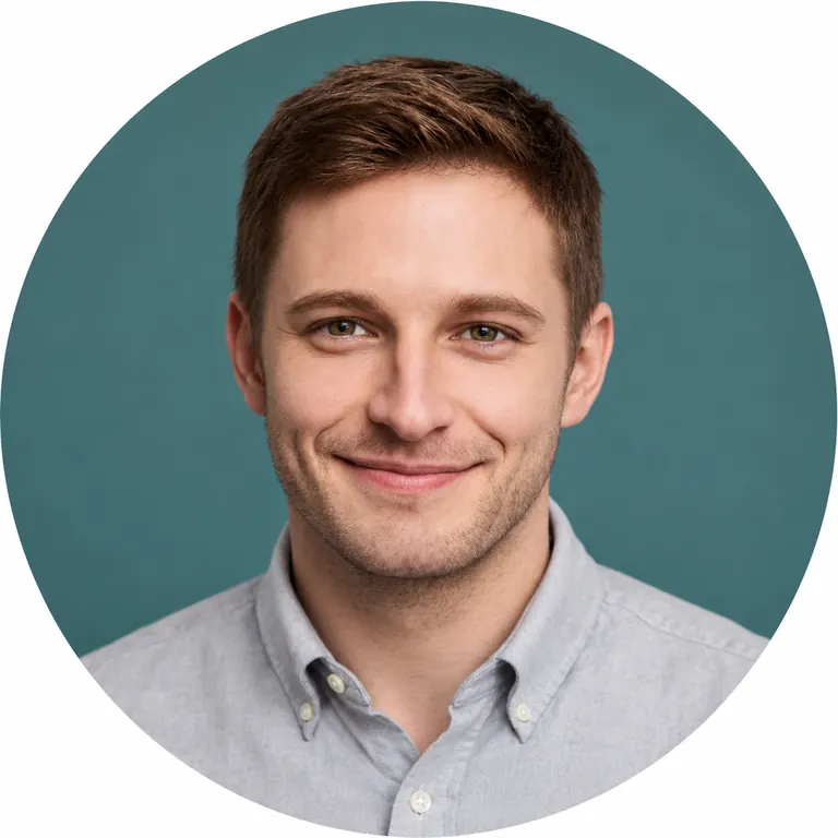 The same man in a light gray shirt on a muted teal backdrop, centered for a round profile crop